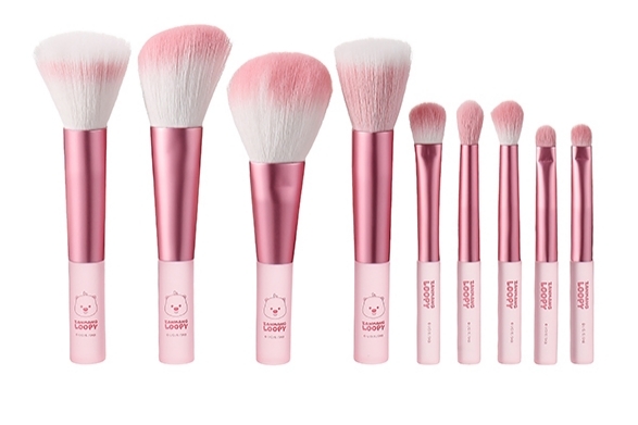 Pink metallic seven-piece makeup brush set with frosted handles and soft synthetic bristles