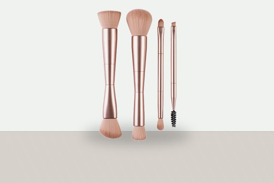 Portable retractable makeup brush shown with its protective cap